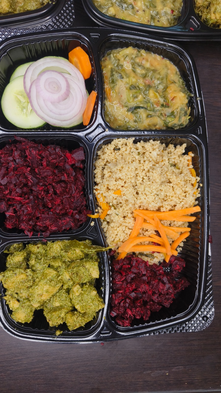 Portioned Military Diet meal trays with millet, beetroot poriyal, green masala chicken and dal